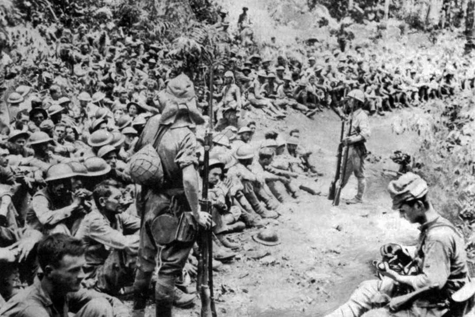 Photo of many men gathered around one man who speaks to them