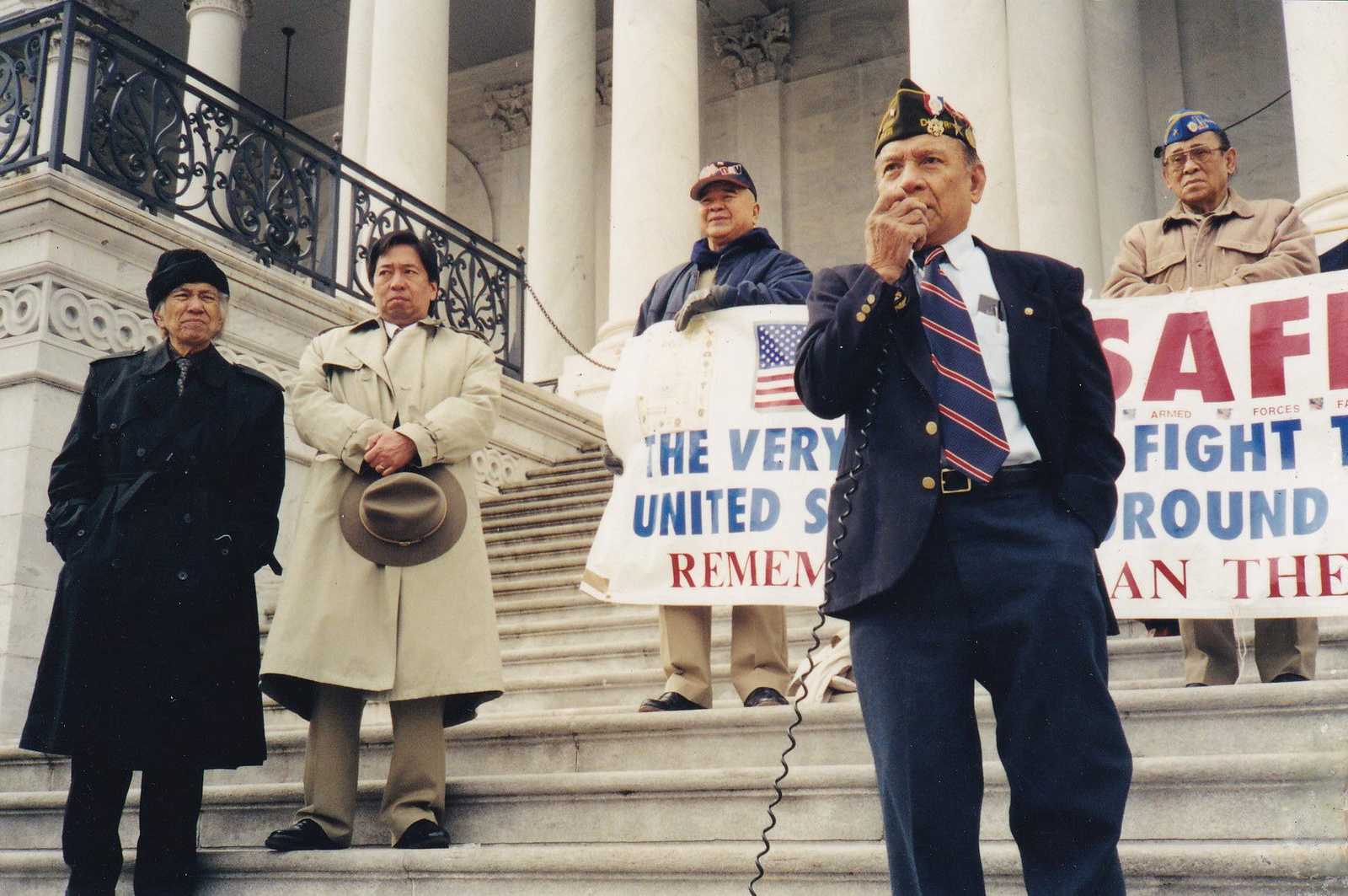 Protestors on steps of government building 