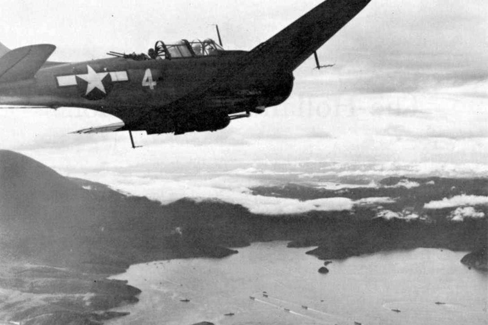 Photo of American plane flying over mountains and bodies of water